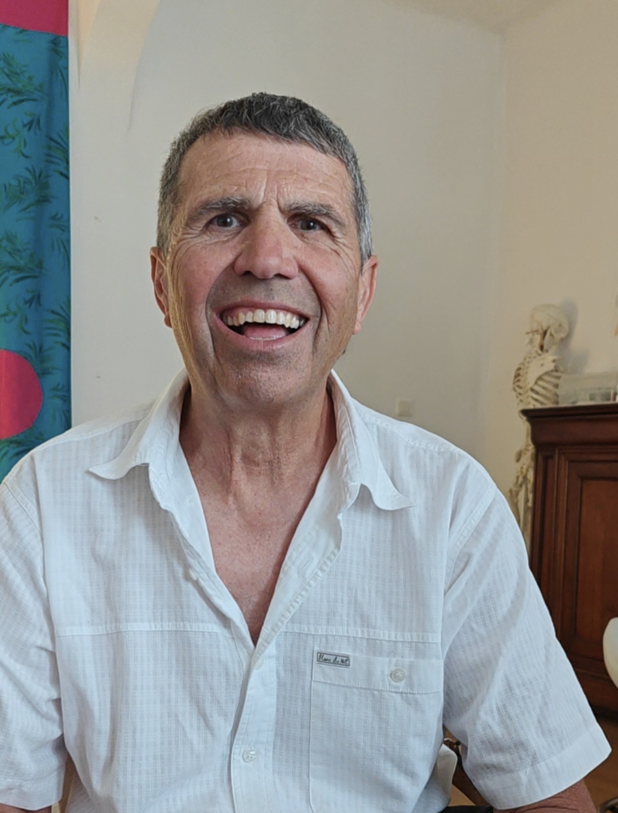 Gérard smiling during follow-up consultation